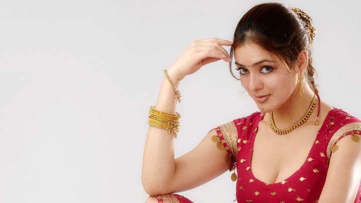 Parvati Melton Sitting In Red Dress Looking Front N Nice Pose